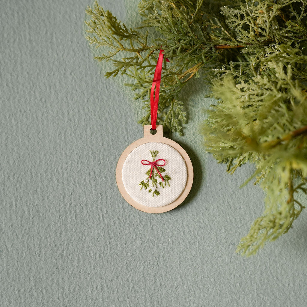 Hand embroidered holiday ornament